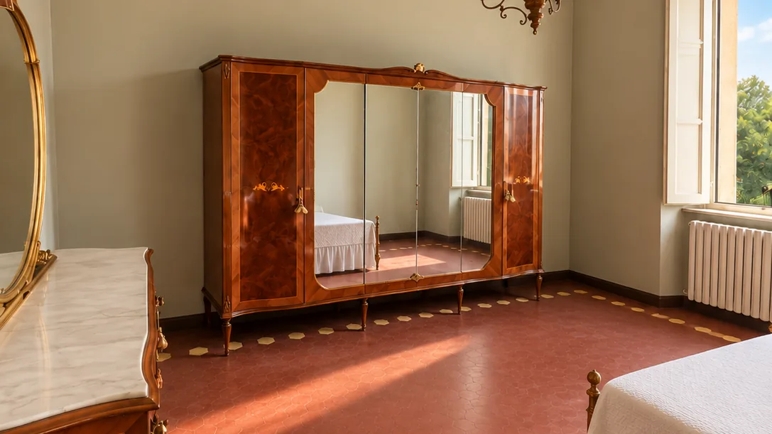 Bright bedroom with vintage mirrored wardrobe, marble-top dresser, tall window and red tiled floor - Hotel Rex, BZAR hotels in Lucca
