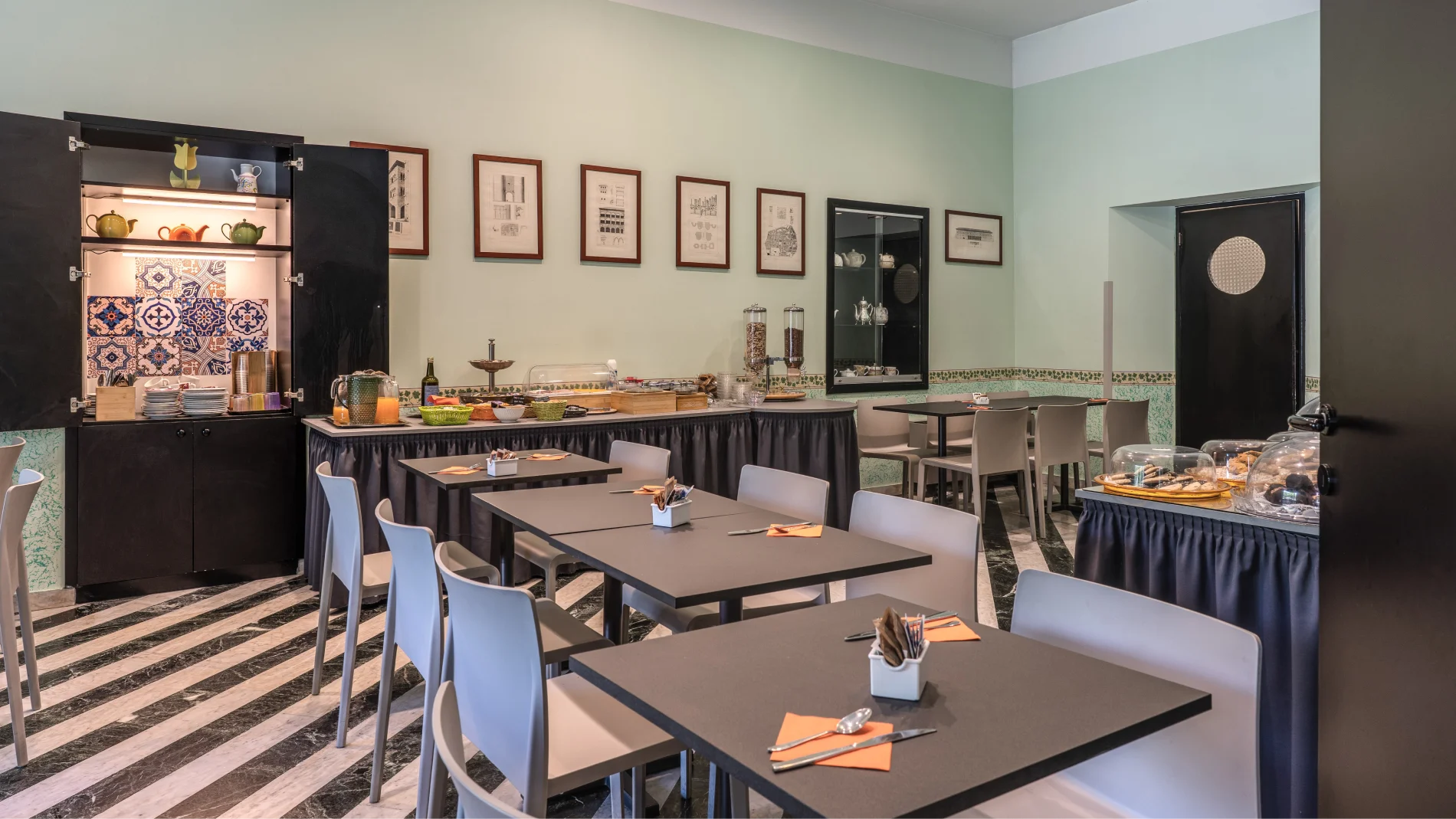 Breakfast room with sweet and savory buffet, modern tables, decorative ceramics and marble floor - Hotel Rex, BZAR hotels in Lucca